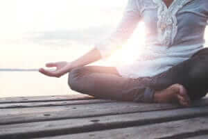 Woman Meditating During Yoga Classes and meditation therapy
