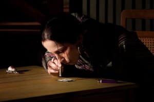 A woman needs a stimulants addiction treatment center